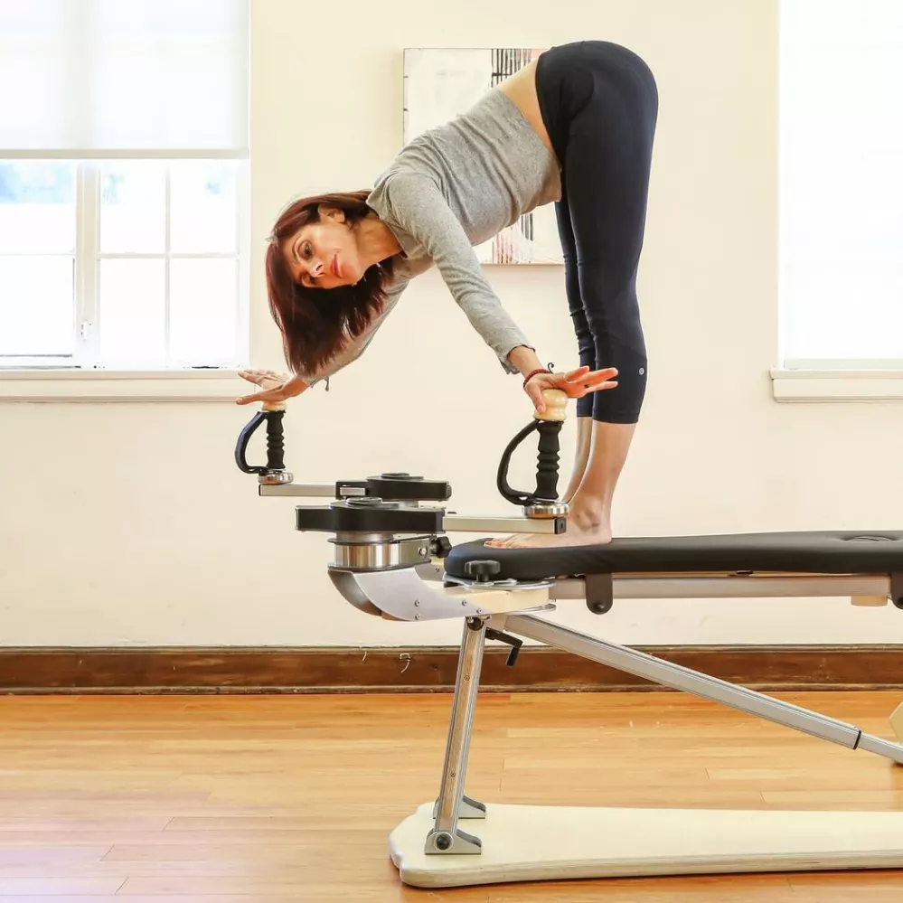 Arpi demonstrating the Gyrotonic® Method on the Pulley Tower at Movement Dynamic